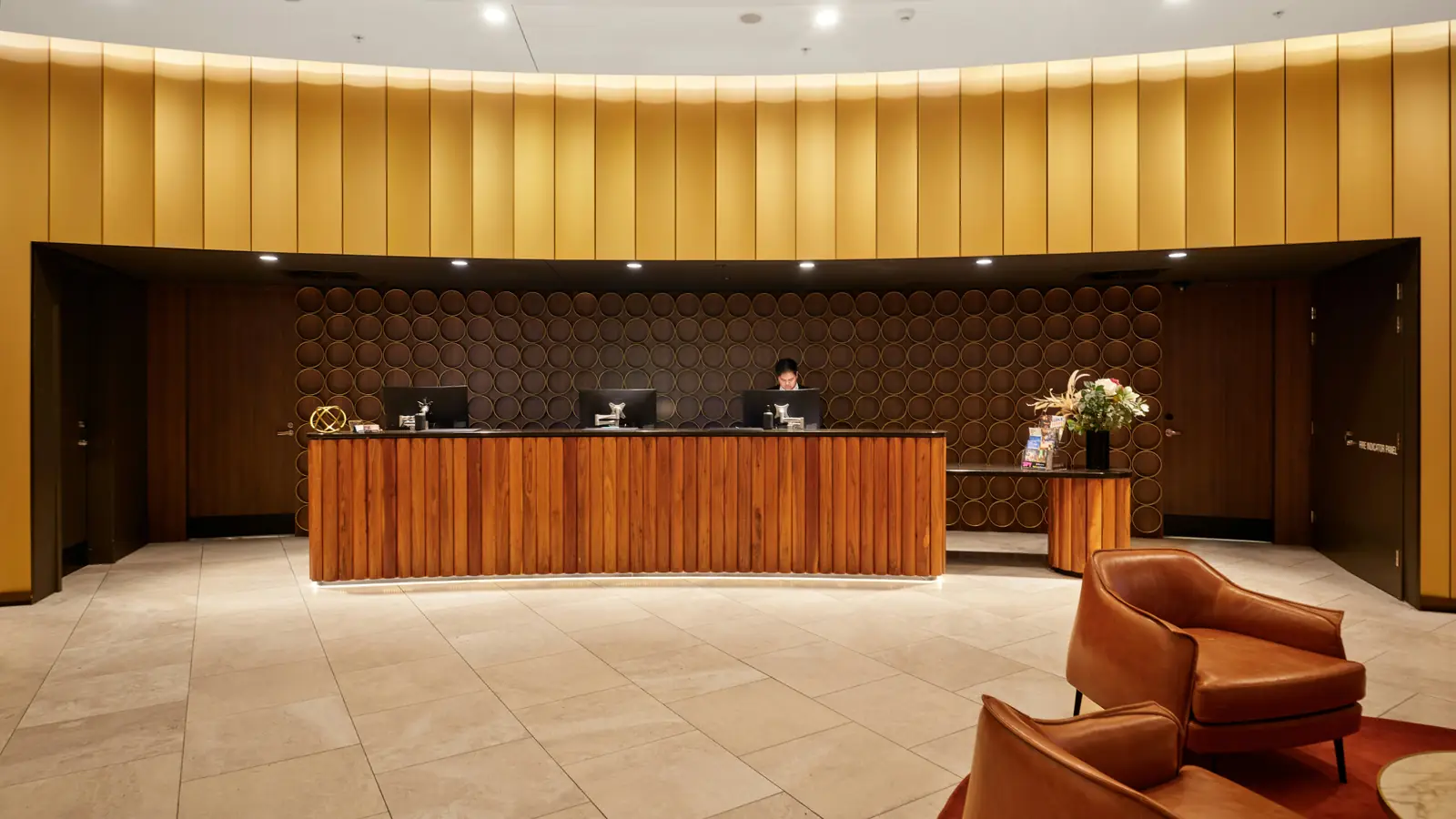 A hotel reception desk in a quiet lobby