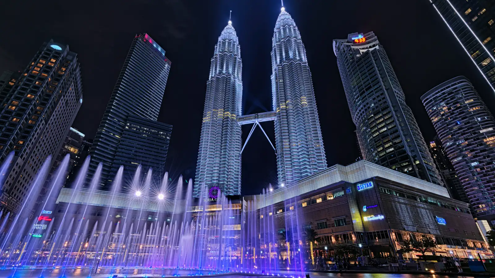 The Petronas Towers and the KLCC fountain in Kuala Lumpur at night