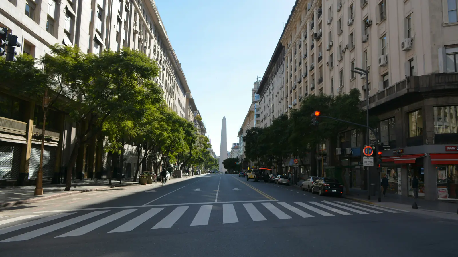 An avenue in Buenos Aires with the Obelisco at the end of the street